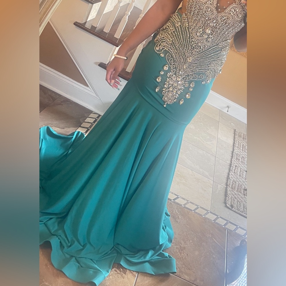 Beautiful long luxurious teal colored dress with rhinestone details
